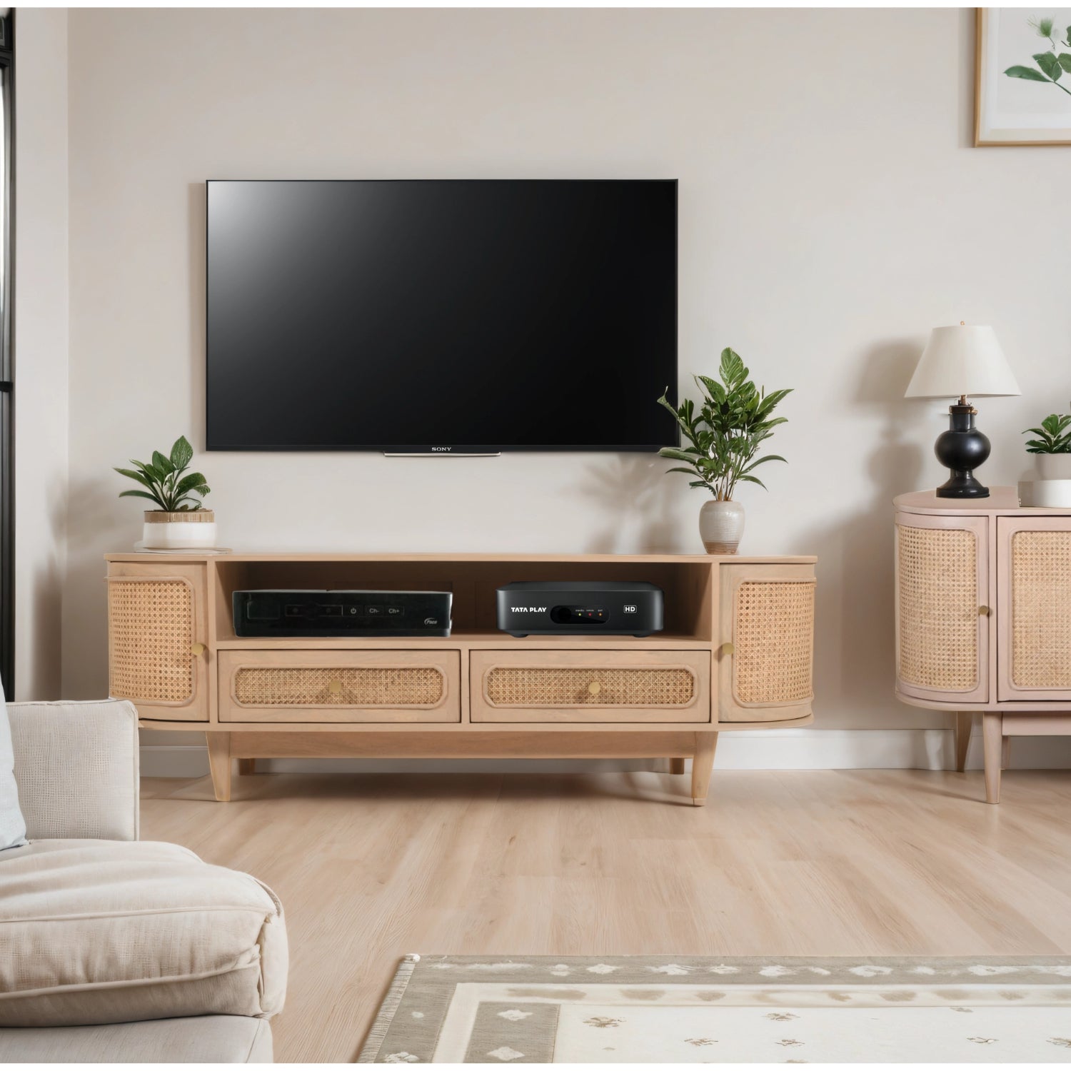 Chester Cane And Wood 2 Drawers TV Cabinet Modern living room with a television mounted on the wall above a wooden cabinet.