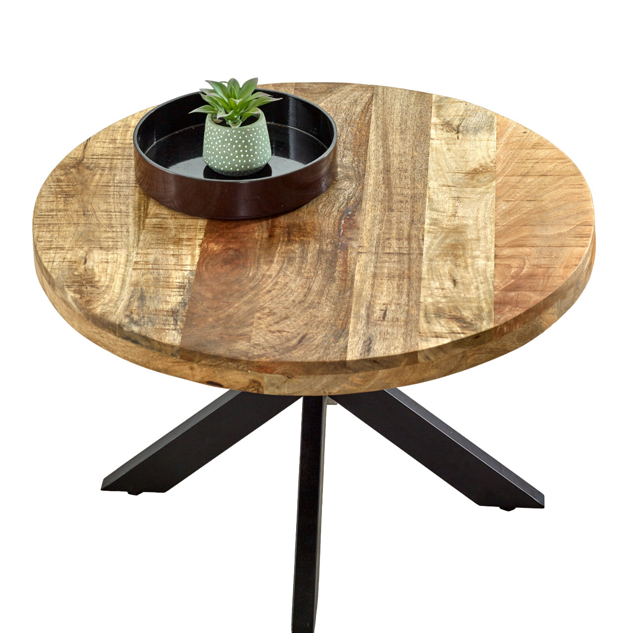 Merlin Mango Wooden Round Coffee Table Spider Legs Round wooden table with black metal legs and a decorative bowl on a white background