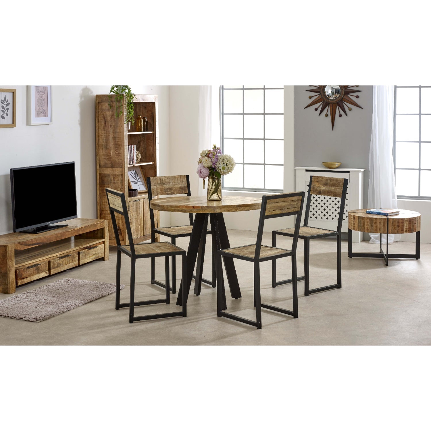 Merlin Mango Wooden Coffee Table With Metal Legs Dining room with wooden table and chairs, TV stand, and decor items.